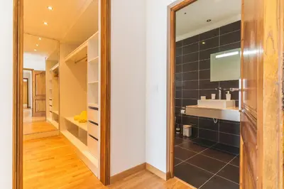 a bathroom with a mirror and a sink at Palm Paradise Villa by AH in Câmara de Lobos