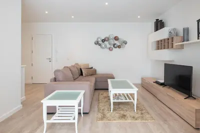 a living room with a couch and two tables at Piornais Apartment by Holiday Rental Madeira in Funchal