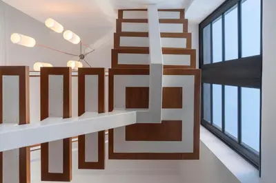a wooden staircase in a room with windows at Eden Funchal by LovelyStay in Funchal