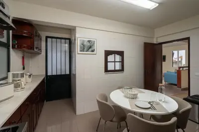 a kitchen and dining room with a table and chairs at Casa Imaculado Coração by An Island Apart in Funchal
