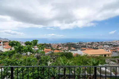 a view of a city from a balcony at Casa Imaculado Coração by An Island Apart in Funchal