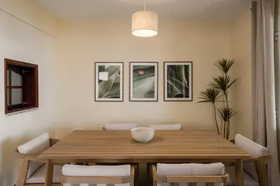 a dining room with a wooden table and chairs at Casa Imaculado Coração by An Island Apart in Funchal