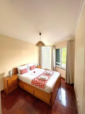 a living room with a bed and a couch at Pilar 2 Stay Funchal, by Specialstays in Funchal