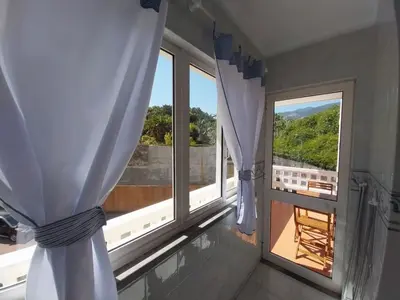 a bathroom with a sink and a toilet and a mirror at Pilar 2 Stay Funchal, by Specialstays in Funchal