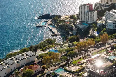 an aerial view of a city next to the water at Savoy Monumentalis IV by An Island Apart in Funchal