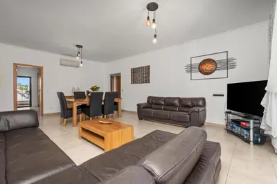 a living room with a couch and a table at Coastal Terrace Apartment in Lagos