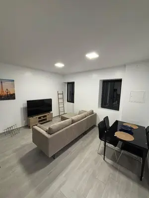 a living room with a couch and a flat screen tv at Vila Ramos I in Funchal