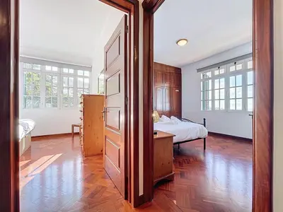 a large room with a bed and a bedroom backdoor at Villa Santa Luzia 2 by Atlantic Holiday in Santa Luzia
