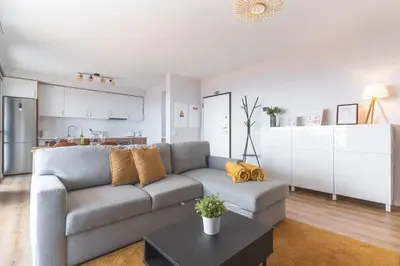 a living room with a couch and a tv at Atlantic Haven by Atlantic Holiday in Caniço