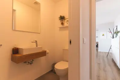 a bathroom with a sink and a toilet at Atlantic Haven by Atlantic Holiday in Caniço
