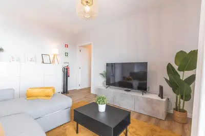 a bedroom with a white bed and a window at Atlantic Haven by Atlantic Holiday in Caniço