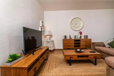 a living room with a couch and a table at Casa Santos- Arco da Calheta in Arco da Calheta