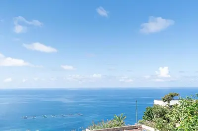a view of the ocean from a building at Casa Santos- Arco da Calheta in Arco da Calheta