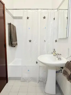 a bathroom with a shower curtain with stars on it at Beautiful Room in the montains in Estrela