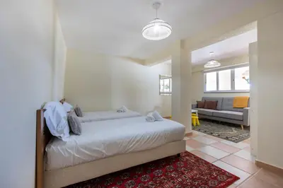 a bedroom with a bed and a living room at Villa Oceana in Luz