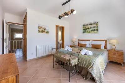 a bedroom with two beds and a television at Villa Oceana in Luz