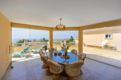 a dining room with a table and chairs at Villa Oceana in Luz