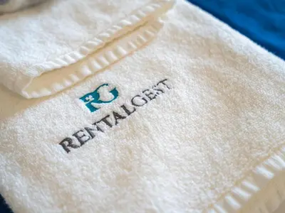 a white towel with the word rutherford on it at Retreat with sea view #1972 in Budens