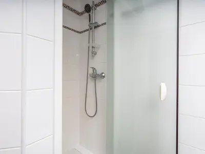 a shower with a shower head in a bathroom at Retreat with sea view #1972 in Budens