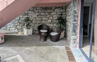 a group of baskets sitting next to a stone wall at Adega Studio in Machico