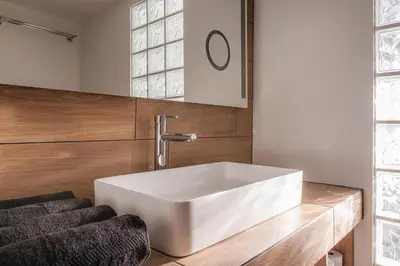 a bathroom with a white sink on a counter at High View Apartment in Funchal