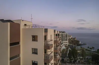 a building with a view of the ocean at High View Apartment in Funchal