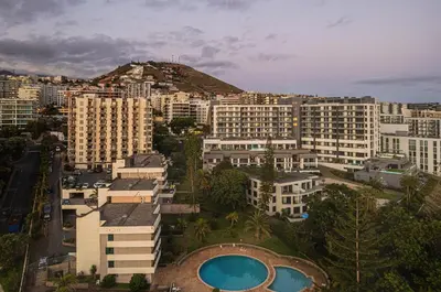 a view of a city with buildings and a mountain at High View Apartment in Funchal