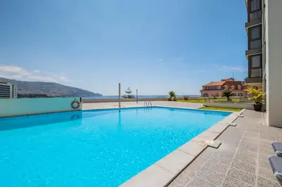 a swimming pool on the roof of a building at Infinity View by Homie in Funchal