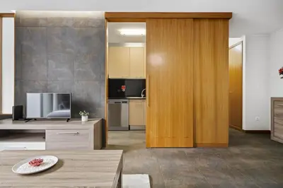 a living room with a tv and a table at Urban Stay 3A by Homie in Funchal
