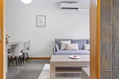 a living room with a blue couch and a table at Urban Stay 3A by Homie in Funchal
