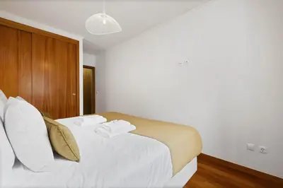 a bedroom with a bed with two towels on it at Urban Stay 3A by Homie in Funchal