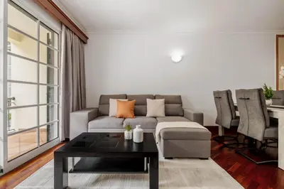 a living room with a couch and a table at Pestanas Nest by Homie in Ribeira Brava