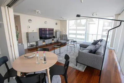 a living room with a couch and a table at Plaza Residence in Funchal