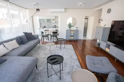 a living room with a couch and a table at Plaza Residence in Funchal
