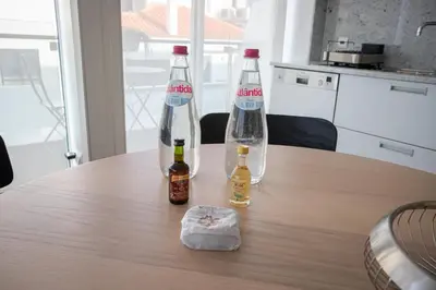 two soda bottles sitting on top of a table at Plaza Residence in Funchal