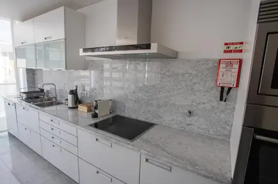 a kitchen with a sink and a counter top at Plaza Residence in Funchal