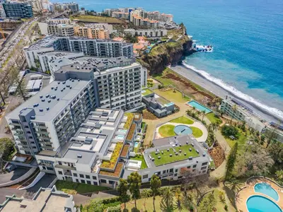 an aerial view of a resort next to the ocean at Design Suite at Formosa Beach in Funchal