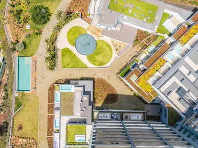 an overhead view of a building with a park at Design Suite at Formosa Beach in Funchal