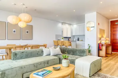 a bedroom with a large bed with two lamps at Villa Arco-Iris, a Home in Madeira in Arco da Calheta