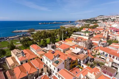 an aerial view of a town with orange roofs at OurMadeira - Taberna Apartments in Funchal