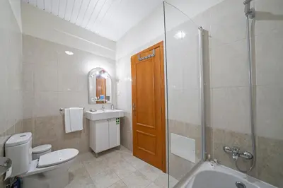 a bathroom with a toilet and a sink and a shower at OurMadeira - Taberna Apartments in Funchal