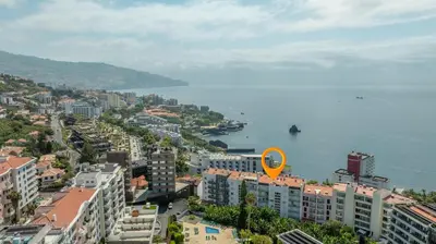 an aerial view of a city and the water at Naval View By Links in Funchal