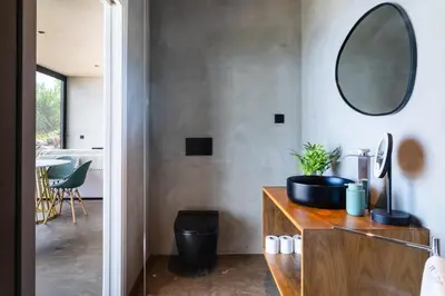 a bathroom with a sink and a mirror on the wall at GuestReady - Relax & Ride the Waves in São Vicente