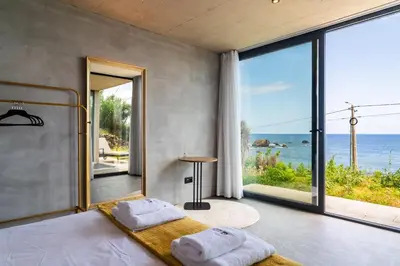 a bedroom with a bed with a view of the ocean at GuestReady - Relax & Ride the Waves in São Vicente