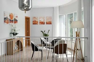 a dining room with a table and chairs at North View Guesthouse in Senhora do Rosário