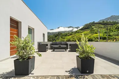 a patio with a view of a mountain at North View Guesthouse in Senhora do Rosário