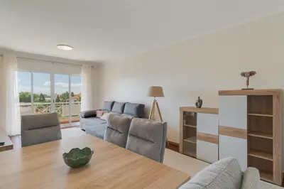 a living room with a couch and a table at Sao Joao- 3 Bedroom apartment in Funchal
