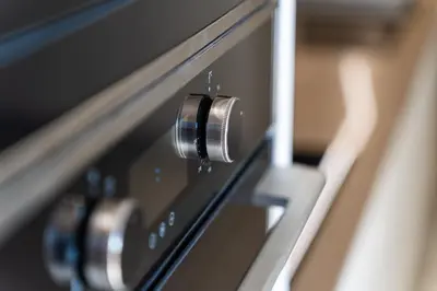 a close up of an oven with a knob at GuestReady - Typical experience in Funchal in Funchal