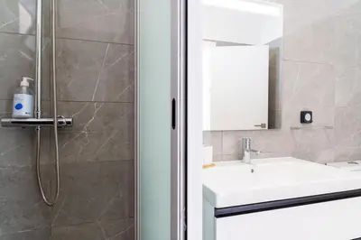 a bathroom with a sink and a shower at GuestReady - Typical experience in Funchal in Funchal