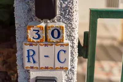 a sign on the side of a pole that says rcc at GuestReady - Typical experience in Funchal in Funchal